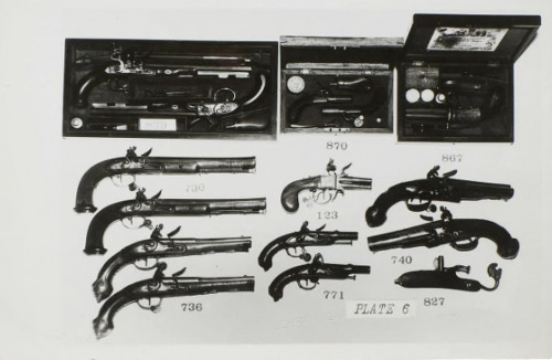 Black and white photograph by Andy Warhol featuring an array of antique pistols arranged catalog-style, including boxed dueling sets.