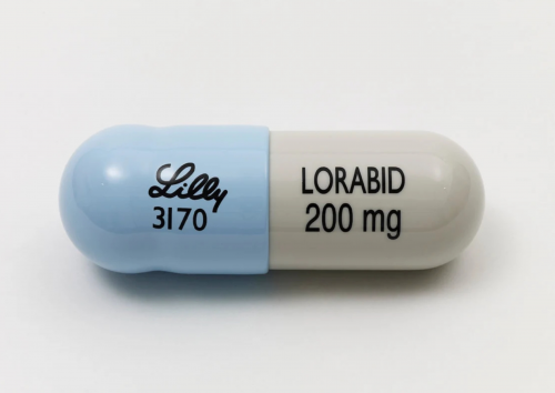 Damien Hirst Lorabid 200mg resin sculpture of large blue and white capsule with black text mimicking antibiotic medication.