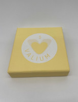 Damien Hirst's Vallium Yellow, polyurethane resin sculpture, shaped like a large yellow Valium tablet with heart cutout.