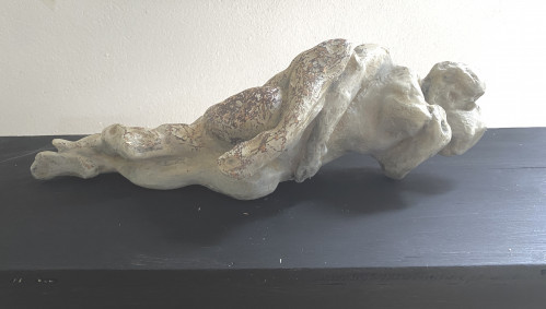 Eva Claessens A Hug (horizontal) bronze sculpture depicting entwined figures with hand-painted patina and textured surface.