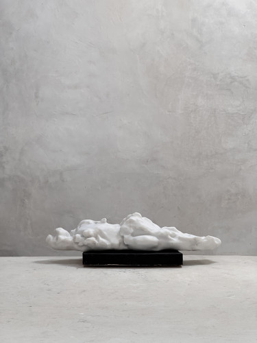 Eva Claessens Seeking the Silence 2025 marble sculpture of low elongated form on dark base against light wall  