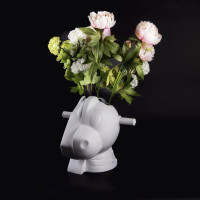 Jeff Koons Split-Rocker Vase, white porcelain, depicting a cartoonish hybrid animal head with flowers blooming from the top.  