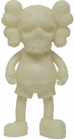 KAWS Pushead Companion vinyl figure in pale tone with skull face and glow-in-the-dark feature, cartoon-like body and X eyes.