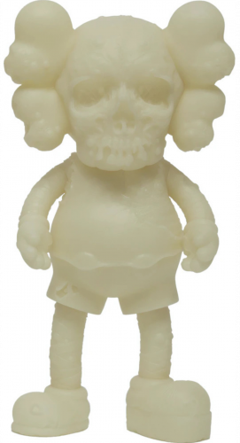 KAWS Pushead Companion vinyl figure in pale tone with skull face and glow-in-the-dark feature, cartoon-like body and X eyes.