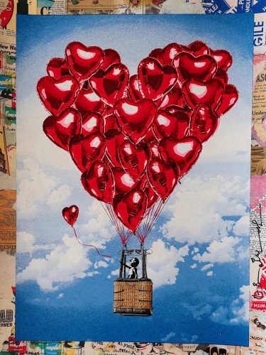 Mr. Brainwash Love Above All mixed media showing a child in a basket lifted by red heart balloons against a blue sky. 
