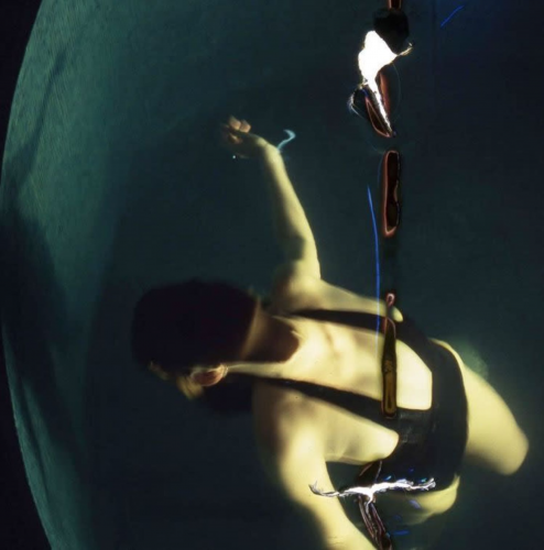 Nan Goldin Sunny at the Spa archival pigment print showing submerged figure distorted by water and golden light.