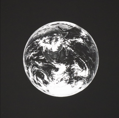 Robert Longo Earth archival pigment print of black-and-white Earth image centered on black background.   