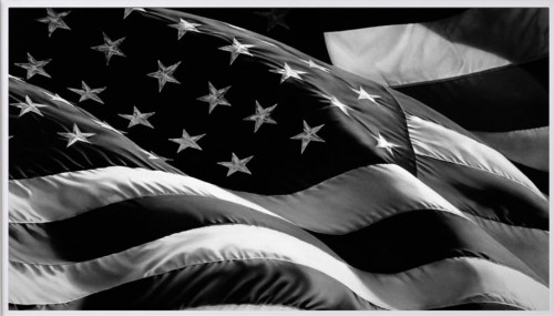 Robert Longo Flag (Old Glory) pigment print showing black and white American flag with dramatic folds and shadows. 