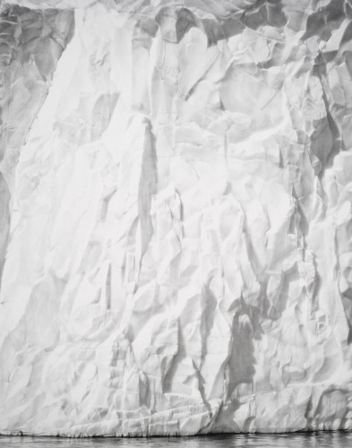 Robert Longo Wall of Ice archival pigment print showing hyperrealistic glacier surface with shadows and reflected water at base.