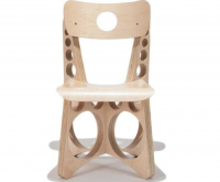 Tom Sachs Shop Chair maple plywood chair with circular cutouts in backrest and legs, functional design with sculptural industrial aesthetic
