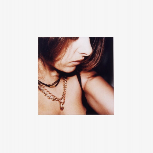 Tracey Emin Self-Portrait 12.11.2001 close-up color photo of artist in profile with layered chains and shoulder exposed, Polaroid aesthetic